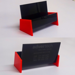 This cute custom designed and fabricated business card holder fits snugly onto any desk.